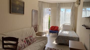 Deluxe Apartment | Living area | TV