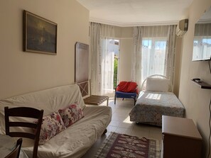 Departamento Deluxe | Área de sala de estar | Televisión 