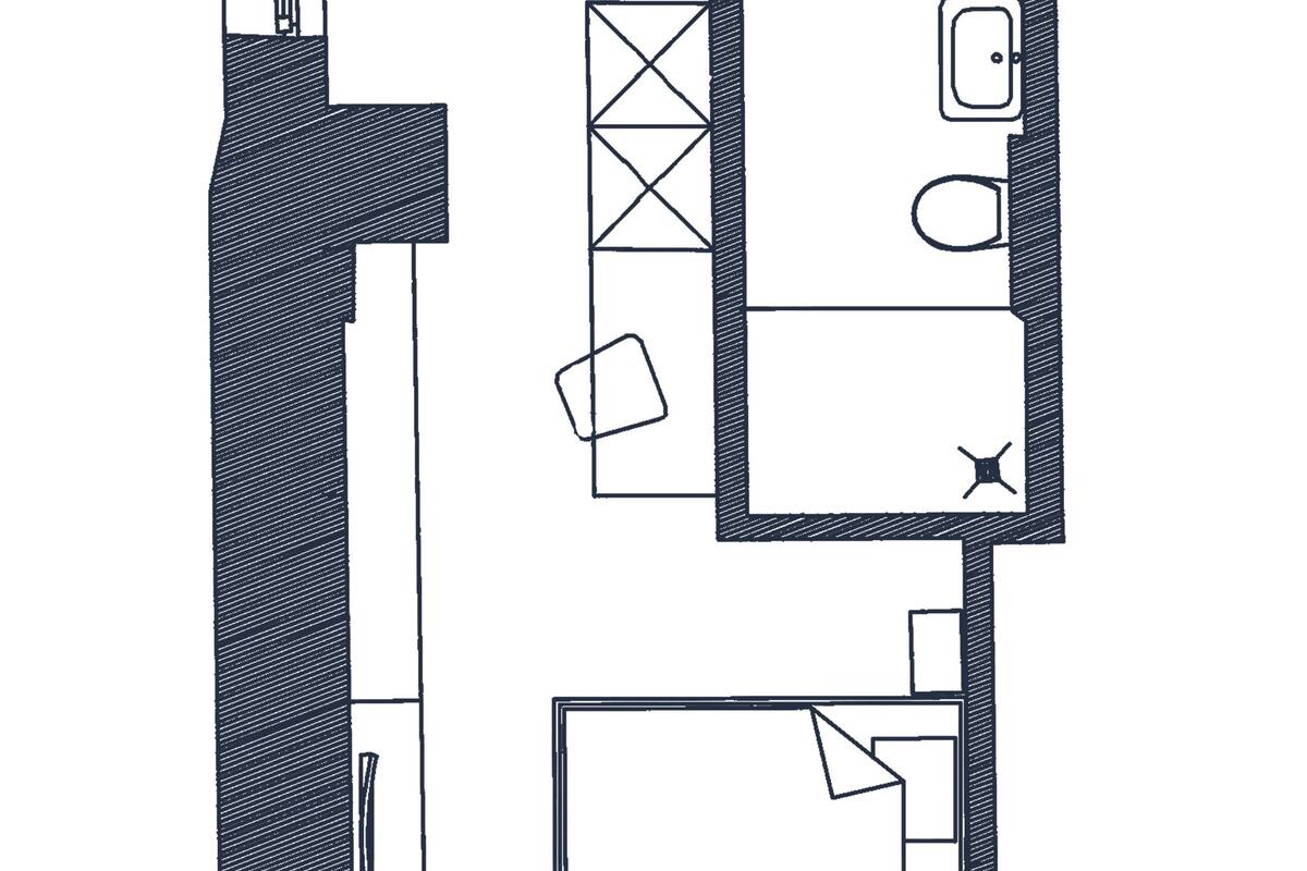 Plano de planta que muestra una cocina, comedor y dos dormitorios.