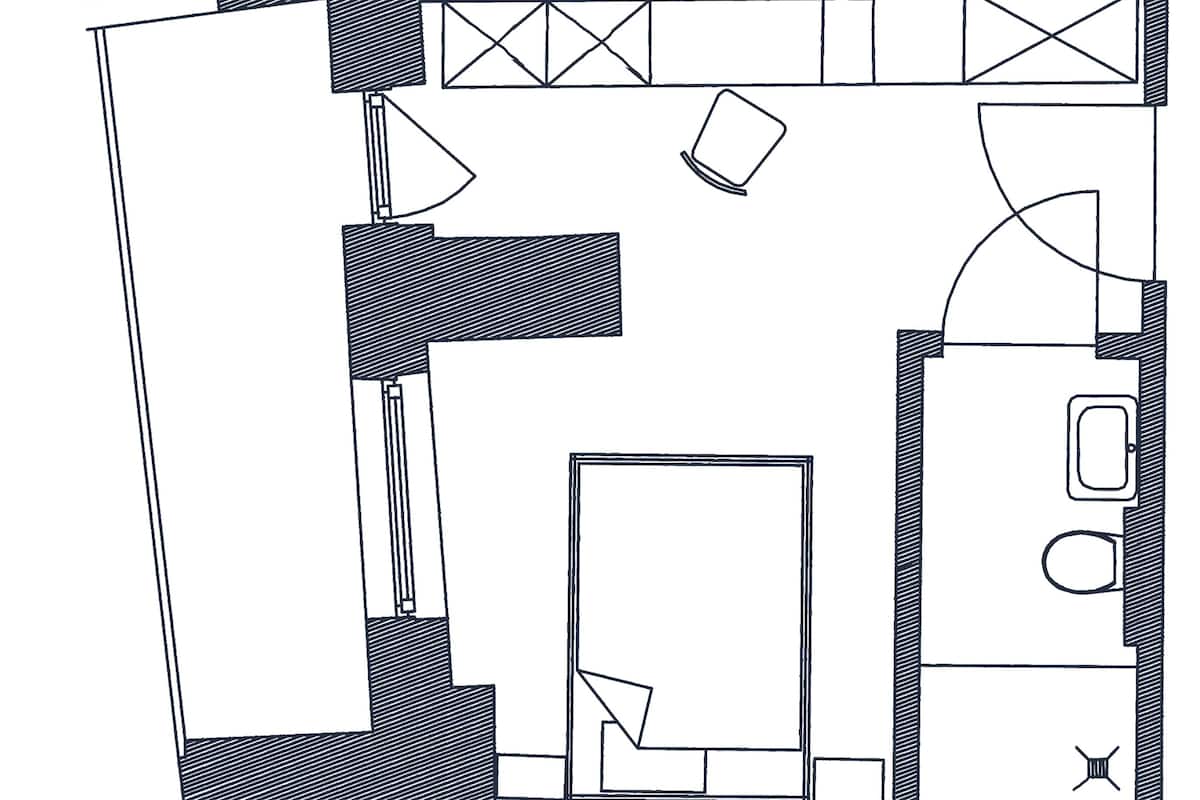 A floor plan with a kitchen, a bathroom, and a living area.