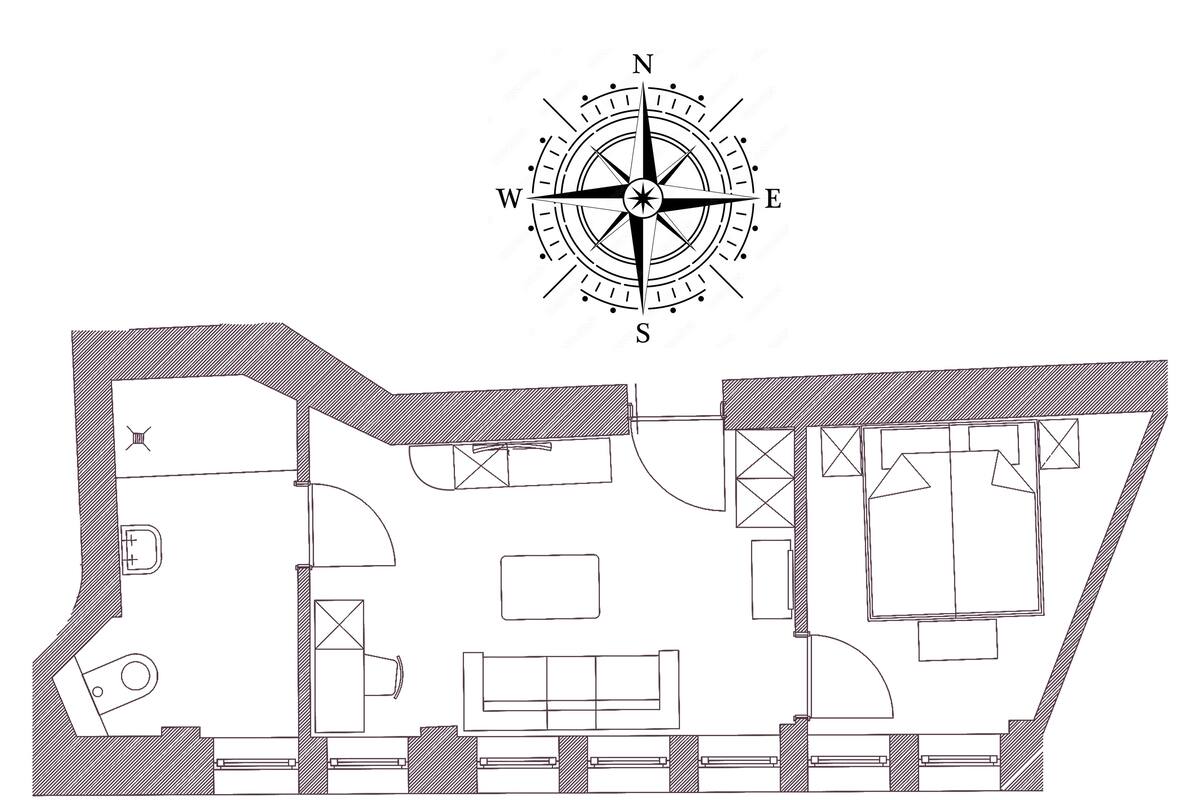 A floor plan with a kitchen, dining area, and two bedrooms.