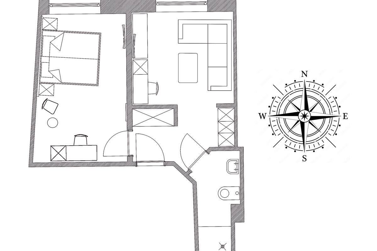 Plano de planta que muestra una cocina, comedor y baño.