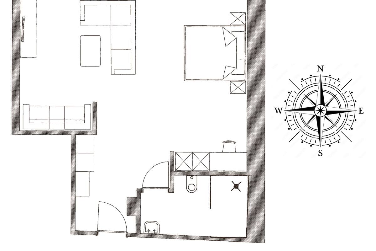 A floor plan with a kitchen, dining area, and two bedrooms.