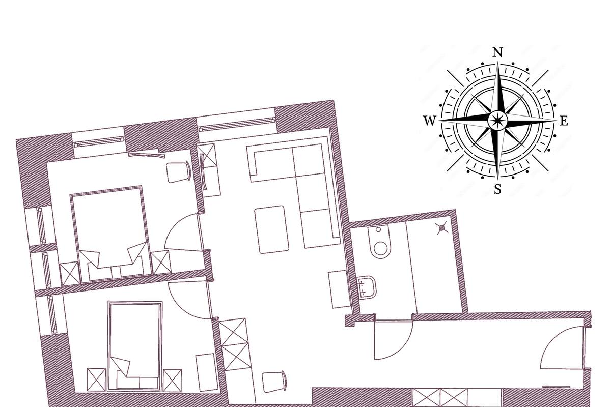 Plano de planta de un edificio con varias habitaciones, incluyendo cocina, comedor y espacios de estar.
