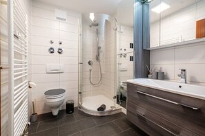Shower, hair dryer, towels, soap