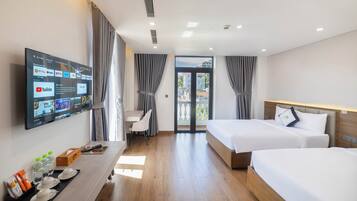 Deluxe Triple Room, Balcony | Minibar, desk, blackout drapes, soundproofing
