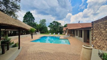 Outdoor pool, open 8:00 AM to 10:00 PM, pool loungers