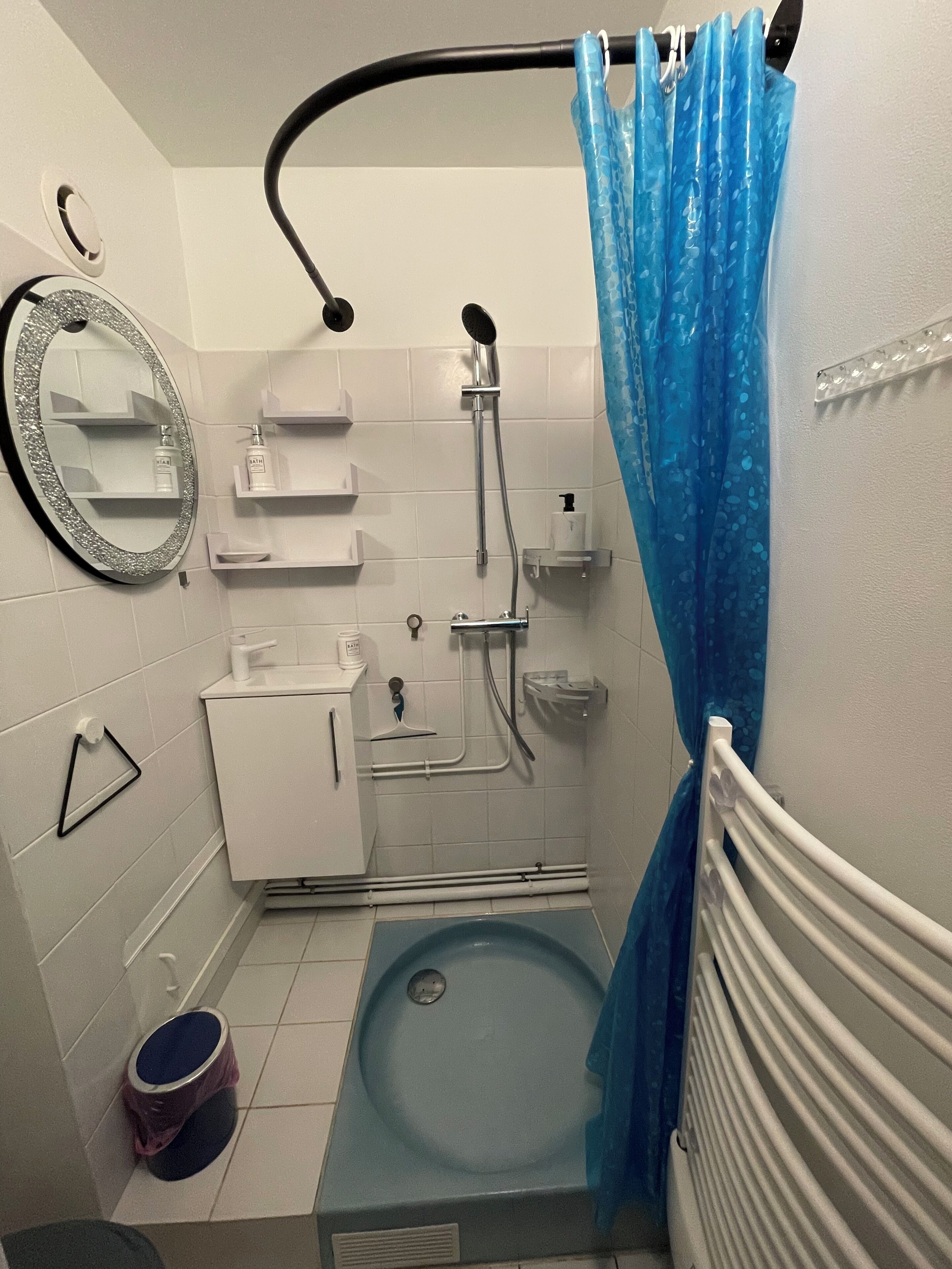 A bathroom with a bathtub, a toilet, a sink, and a shower.