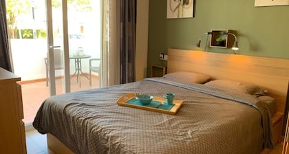 A fresh modern apartment on a lovely garden with a shared pool