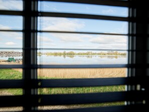 Enjoy a serene view of the lake and surrounding trees from the comfort of your room.