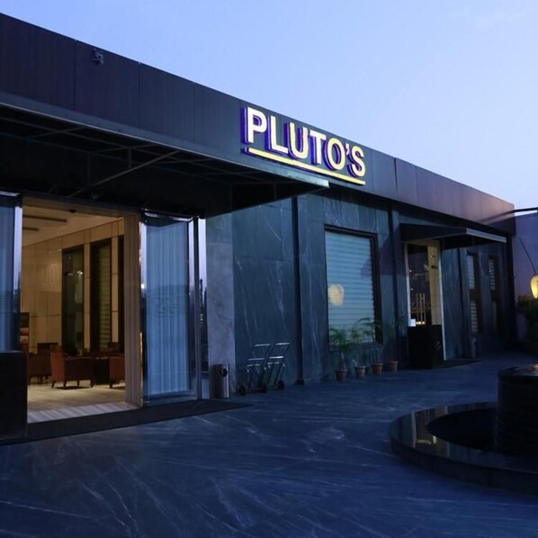 Front of property – evening/night - PLUTOS HOTEL (New Delhi)