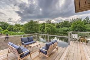Terrace/patio - Lakefront eco-cabin with boat, 4km of walkways & steam engines. Amazing Views.
(Keighley)