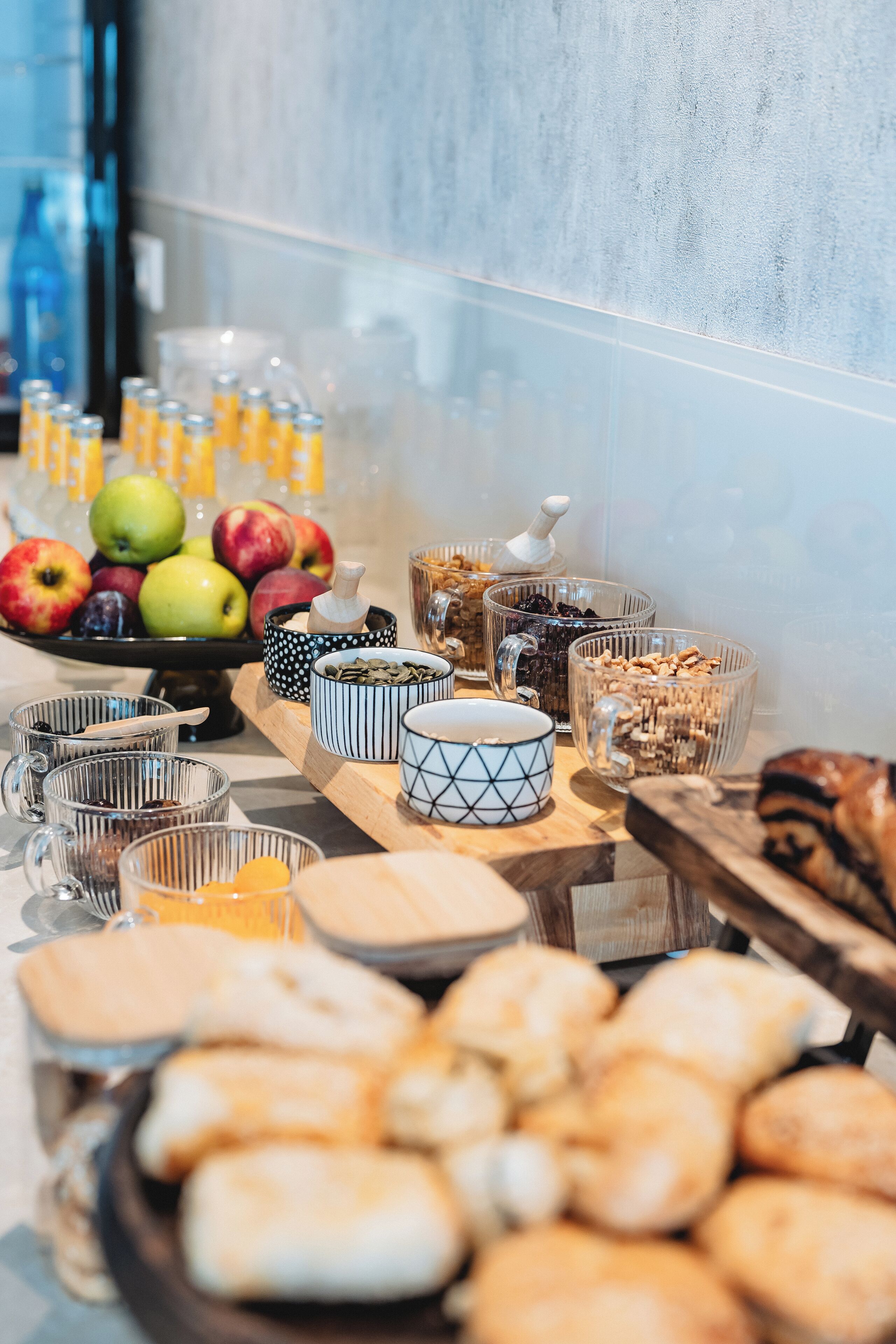 A breakfast buffet with various food items and beverages.