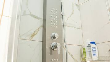 Shower, hair dryer, soap, shampoo