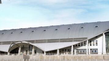 A modern building with a curved roof and large windows.