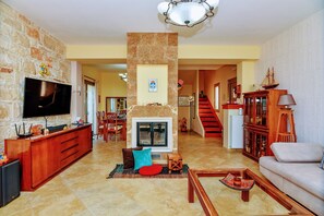 Classic Villa, 3 Bedrooms, Jetted Tub | Living area | 52-inch LCD TV with digital channels, fireplace - Adam Stone Villa (Zakynthos)