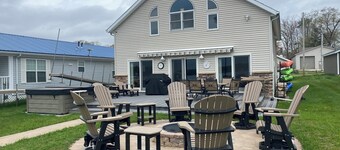 Relax at the outdoor firepit or hot tub overlooking all-sports Eight Point Lake!