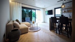 A modern living room with a sofa, a dining area with chairs, a large window, and a TV mounted on the wall.