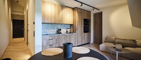 Deluxe Apartment, Balcony, Mountain View | In-room dining