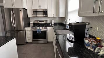 Coffee/tea maker, fridge, microwave, oven