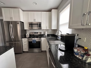 Coffee/tea maker, fridge, microwave, oven