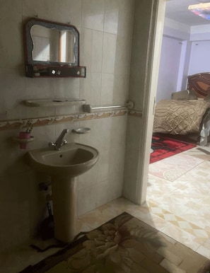 Comfort Apartment | Bathroom | Deep-soaking bathtub, rainfall showerhead, designer toiletries