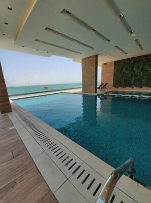 Pool - A Luxurious Sea View 1 Bedroom Apartment (Al HIDD)