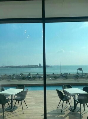 Outdoor dining - A luxurious sea view 2 bedrooms apartment (Al HIDD)