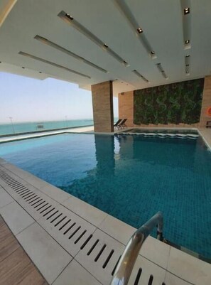 Pool - A luxurious sea view 2 bedrooms apartment (Al HIDD)
