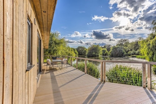 3 bed Lakeside Eco-Lodge with boat, 4km of walkway & watch the steam engines.

