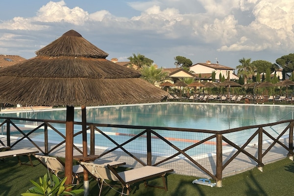 Seasonal outdoor pool, open 9:00 AM to 8:00 PM, pool umbrellas