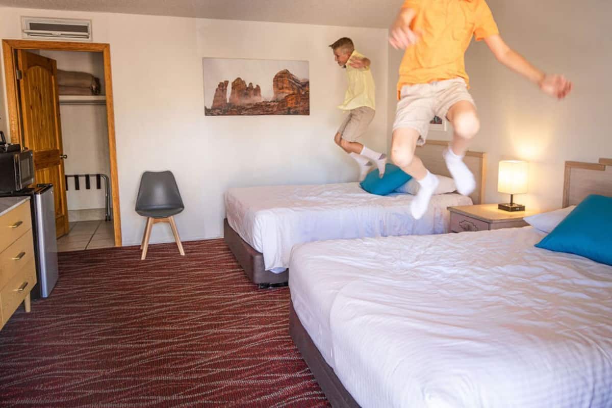 Basic Room, 2 Queen Beds | Laptop workspace, blackout drapes, iron/ironing board, free WiFi