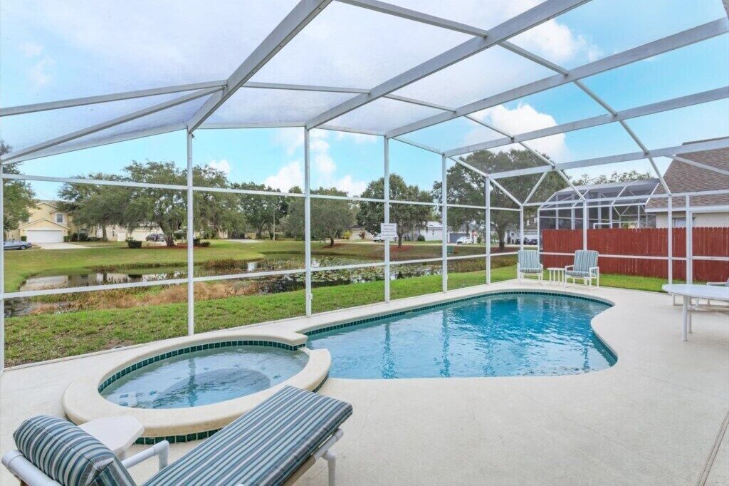Contemporary pool home with hot tub and games room overlooking nature pond