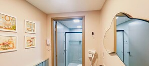 Relax in a stylish space with a large mirror, telephone, and hairdryer.