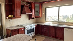 Fridge, microwave, oven, electric kettle - Abdoun Apartment, lovely place to spend your time at.
 (Amman)