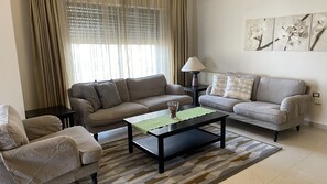 TV, fireplace, DVD player - Abdoun Apartment, lovely place to spend your time at.
 (Amman)