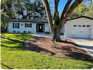 Entrance with private driveway, additional parking available.