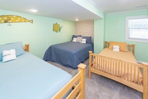 A room with three beds, each with a different headboard design, and a window with blinds. - 4 Play- 5 Bd., Dog Friendly, Game Rm., Private Pool, Easy Bch Access (Virginia Beach)