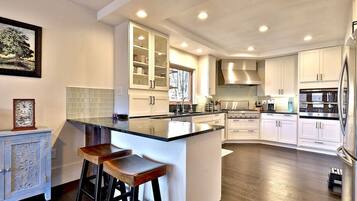 Coffee/tea maker, fridge, microwave, oven