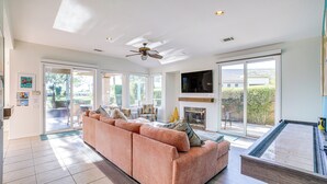 A spacious living room with a large sectional sofa, a pool table, and a fireplace. - Cathedral City Home w/ Private Pool - Near Golf (Cathedral City)