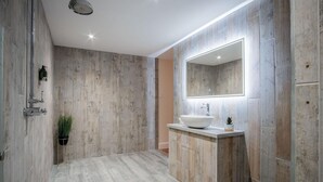 A modern bathroom with a large mirror, a vessel sink, and a shower. - Suite 4 - Sleeping Giant Hotel - Pen Y Cae Inn (Swansea Valley)