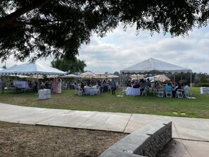 Guests can enjoy outdoor events and activities in a scenic park setting.
