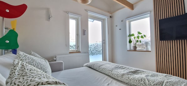 1 bedroom, desk, iron/ironing board, travel crib