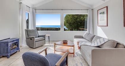 Oceanfront cottage on a bluff with beach views, deck, streaming & kitchenette