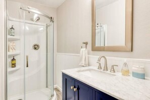 Shower, eco-friendly toiletries, hair dryer, towels