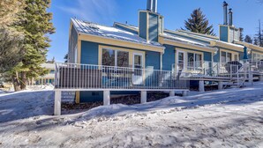 A two-story building with a snow-covered deck and a chimney. - Cloudcroft Vacation Rental ~ 4 Mi to Skiing! (Cloudcroft)