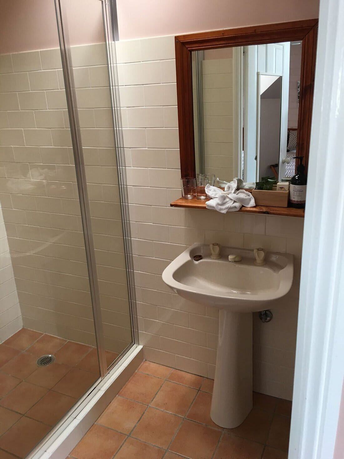 Shower, hair dryer, towels, shampoo