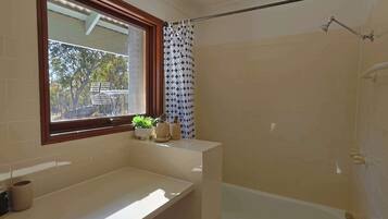 Shower, hair dryer, towels, shampoo