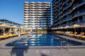 Indoor pool, seasonal outdoor pool, pool umbrellas, pool loungers