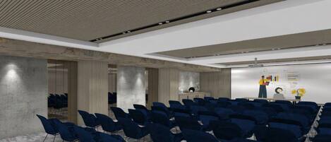 A conference room with rows of chairs, a presentation screen, and a podium.